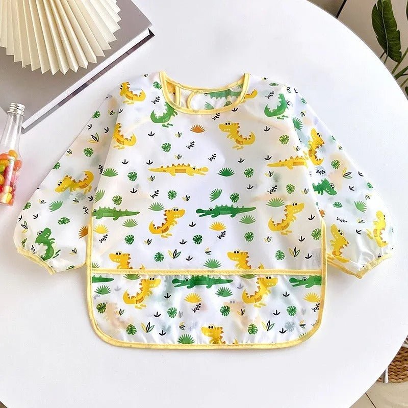 bavoir bébé étanche blanc avec motifs crocodiles jaunes et verts