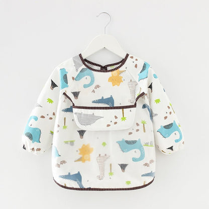 présentation du bavoir bébé manche longue imperméable modèle dinosaures