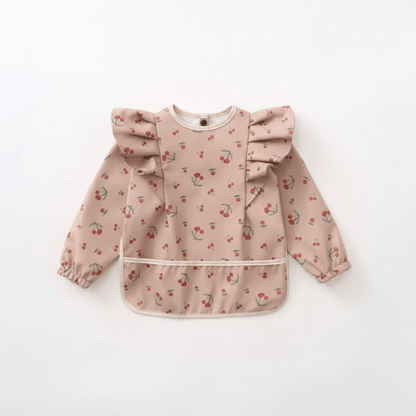 bavoir manche longue coloris rose motif cerises