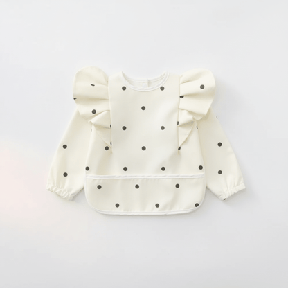 bavoir manche longue coloris blanc motif pois noirs