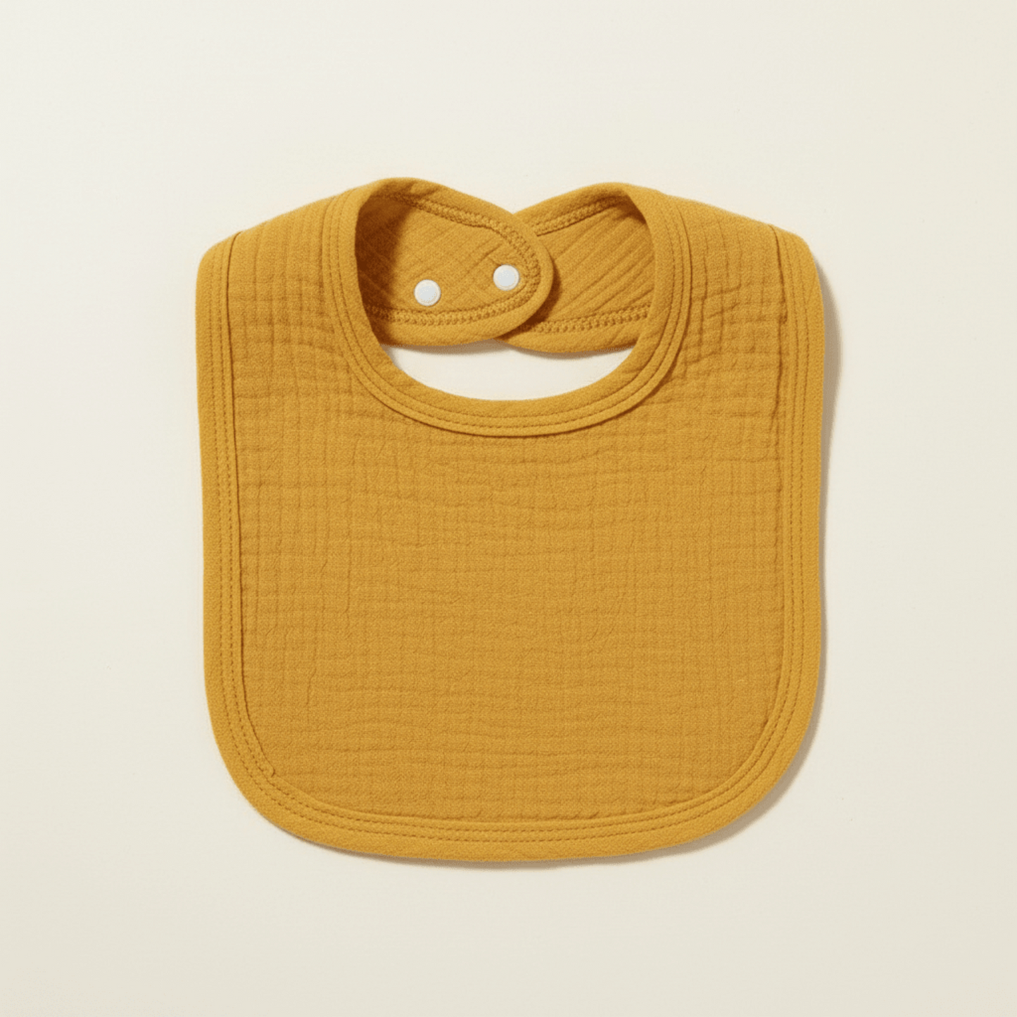 présentaton du bavoir en coton absorbant jaune moutarde