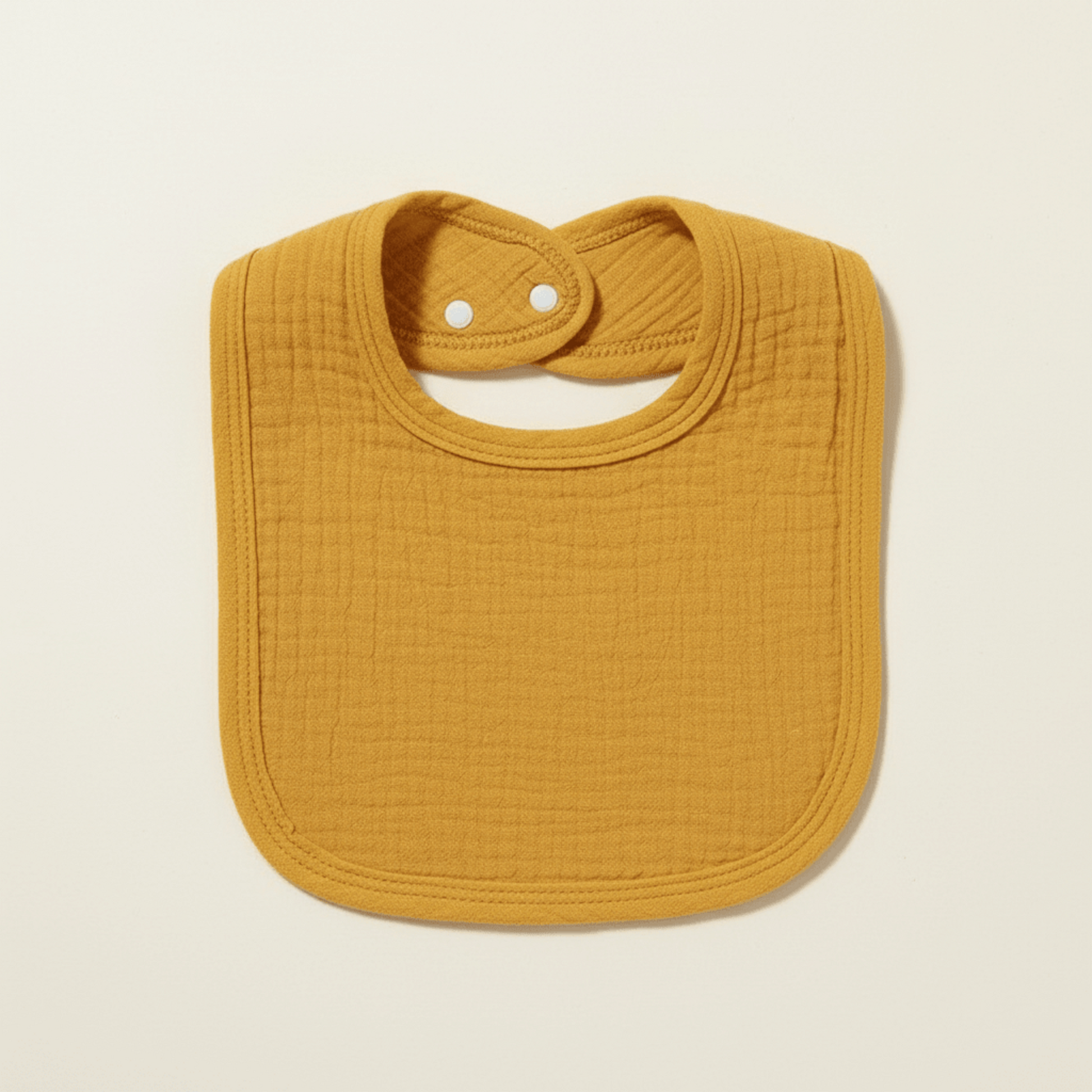 présentaton du bavoir en coton absorbant jaune moutarde