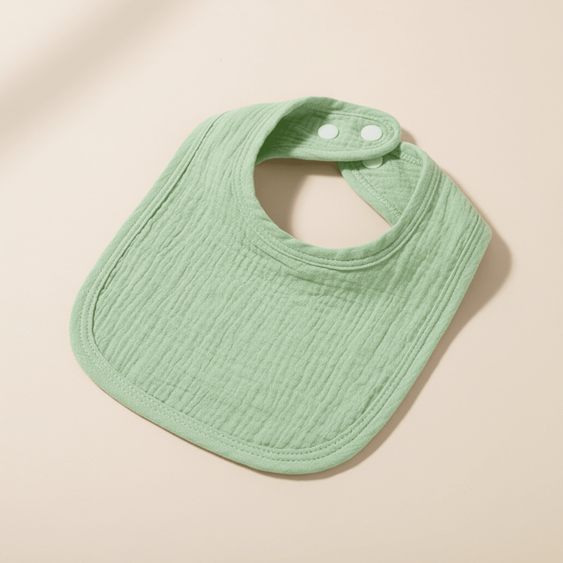 présentaton du bavoir en coton absorbant vert menthe