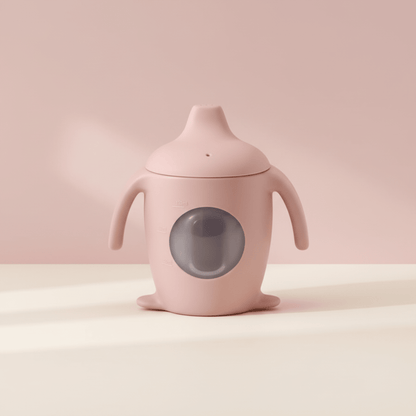 présentation de la tasse d'apprentissage bebe avec hublot coloris rose clair